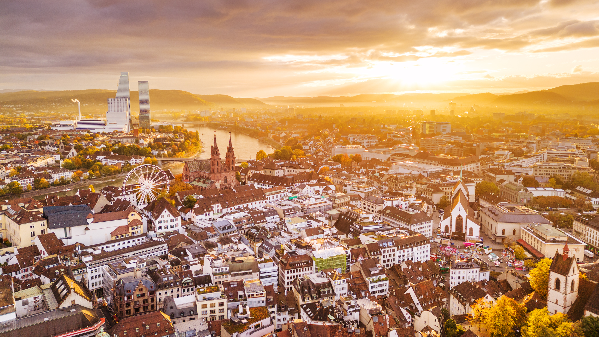 fensterproduzent-naehe-basel Basel aus der Vogelperspektive im Sonnenuntergang
